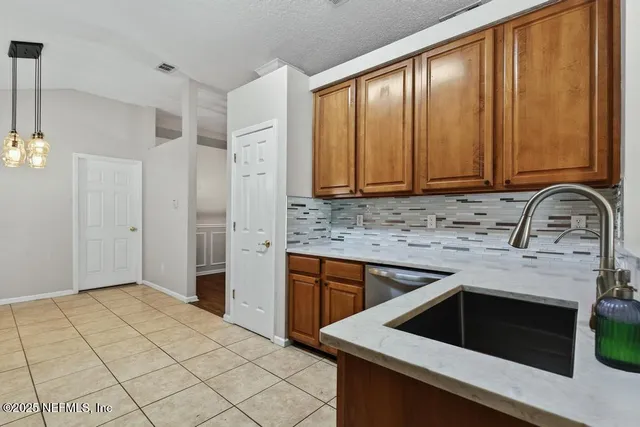 a bedroom with a bed a couch and a window