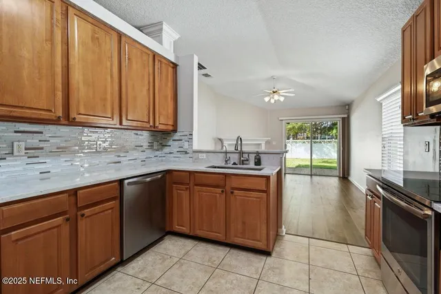 a bath tub sitting in a bathroom next to a sink