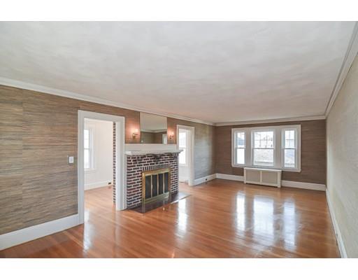 9 Merrill Road Watertown, MA 02472 - Photo 3 of 14 a big room with wooden floor fireplace and windows