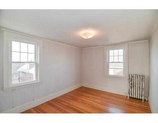 9 Merrill Road Watertown, MA 02472 - Photo 10 of 14 an empty room with wooden floor and windows
