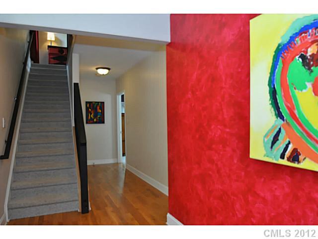 a view of an entryway with wooden floor