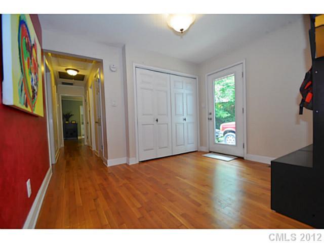 4331 Applegate Road Charlotte, NC 28209 - Photo 12 of 16 a view of an empty room with window and wooden floor