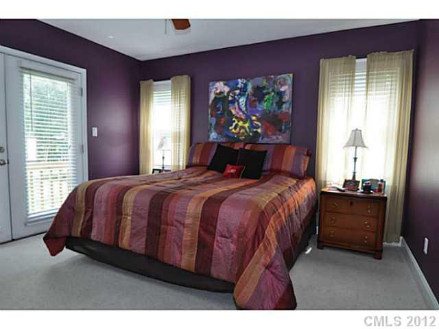 4331 Applegate Road Charlotte, NC 28209 - Photo 4 of 16 a bedroom with a bed and a painting on the wall