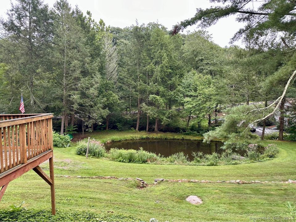 386 Cherry Brook Road Canton, CT 06019 - Photo 14 of 16 a view of a golf course with a lake
