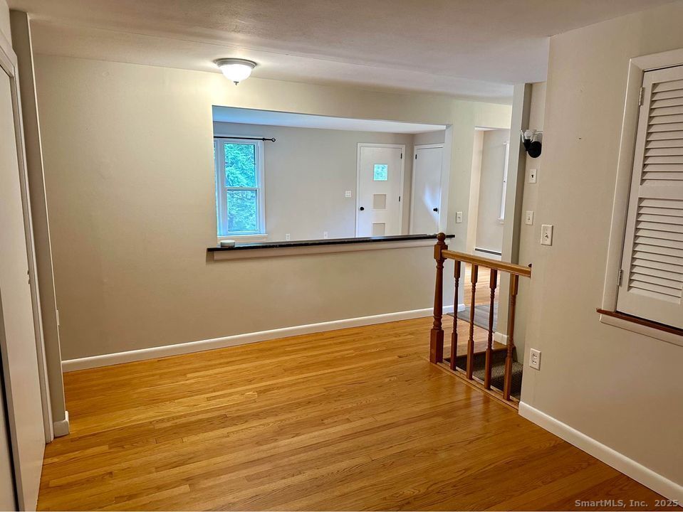 386 Cherry Brook Road Canton, CT 06019 - Photo 2 of 16 a view of a room with wooden floor and front door