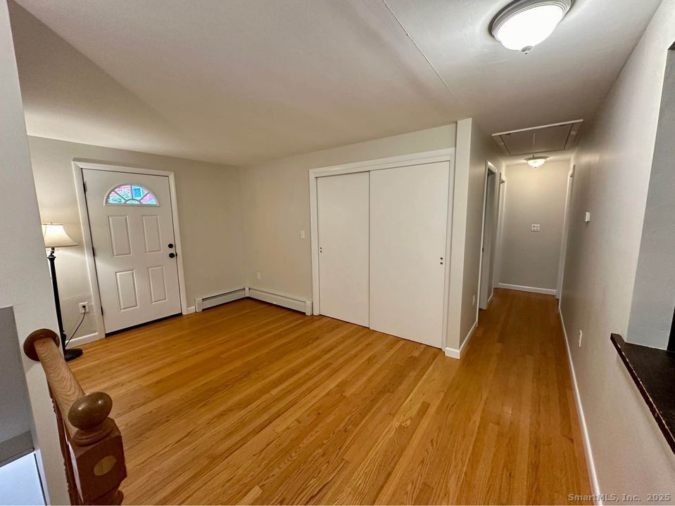 386 Cherry Brook Road Canton, CT 06019 - Photo 3 of 16 a view of a room with wooden floor