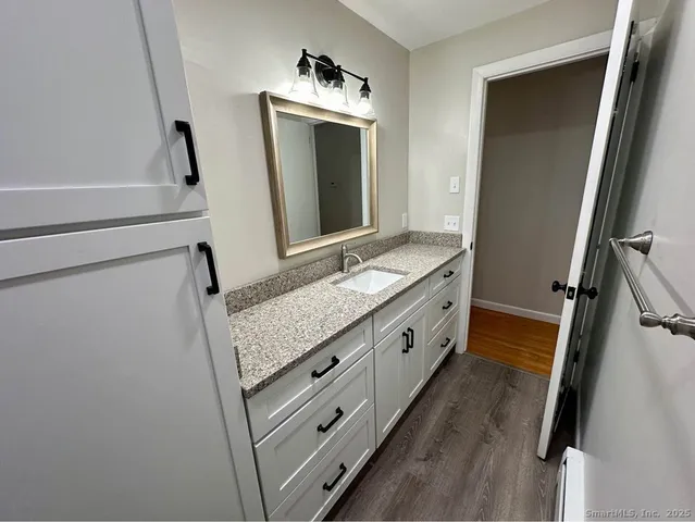 a bathroom with a double vanity sink and mirror