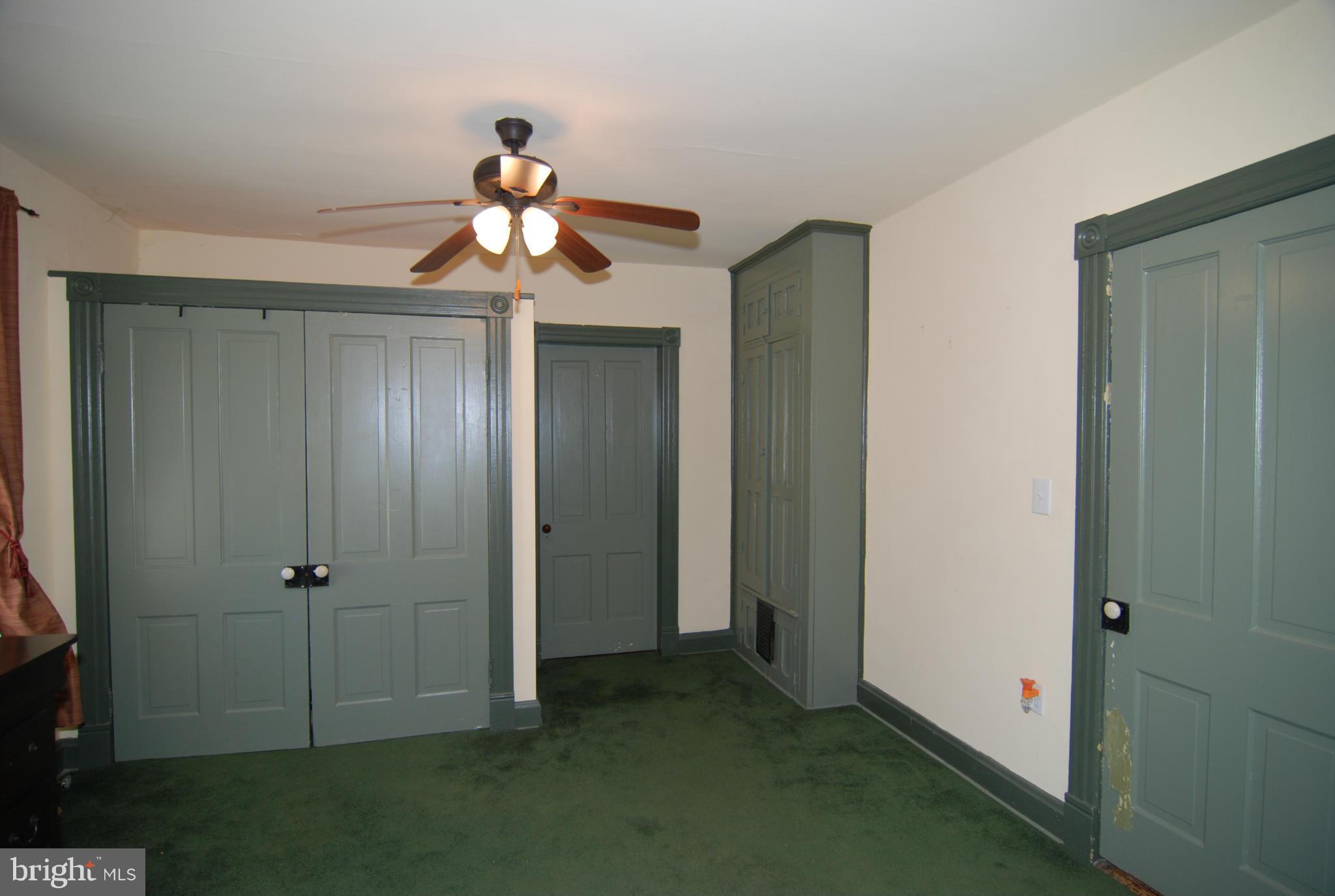 4256 Main Street Rohrersville, MD 21779 - Photo 16 of 26 a view of a chandelier fan and hardwood floor