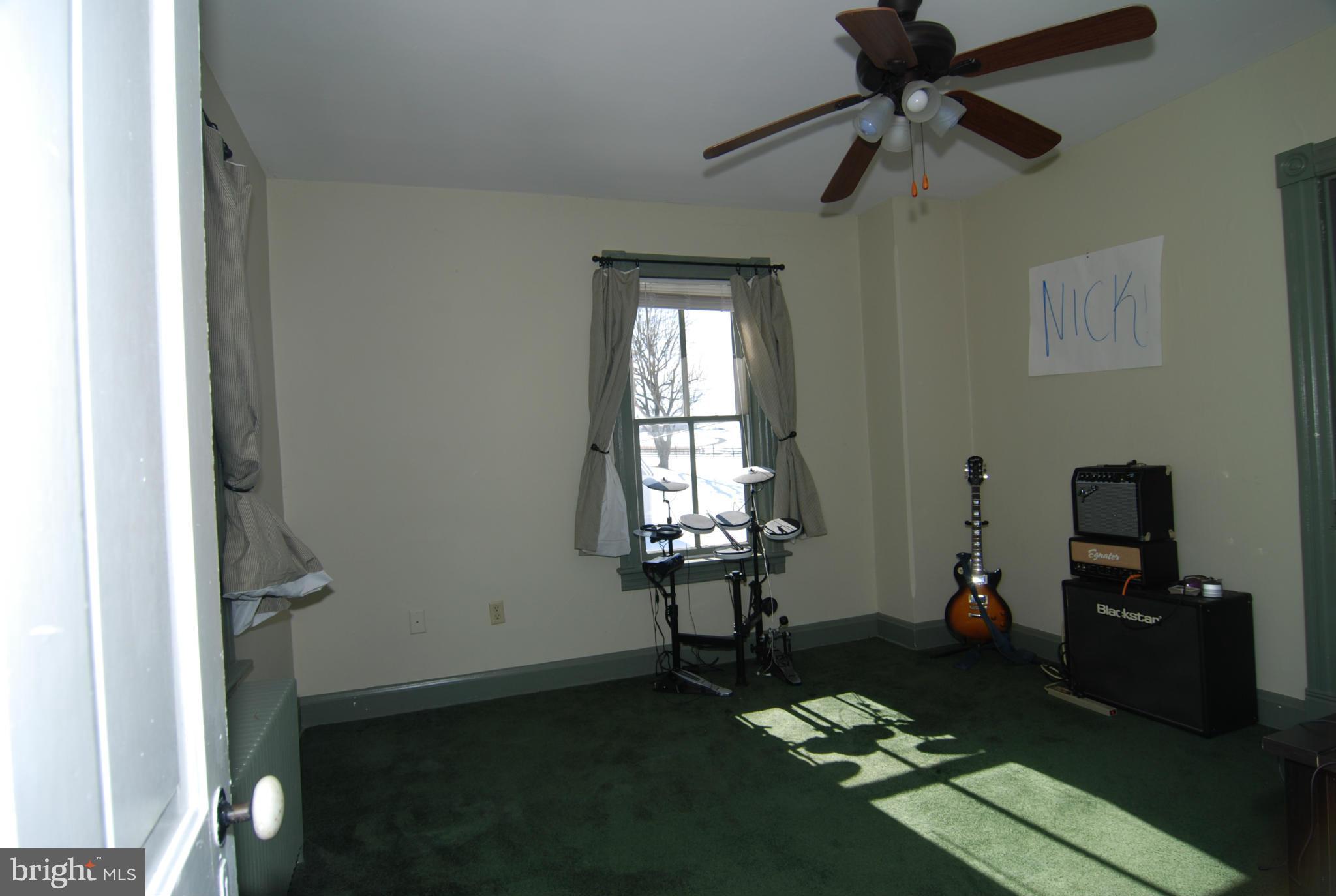 4256 Main Street Rohrersville, MD 21779 - Photo 19 of 26 a living room with furniture and a flat screen tv