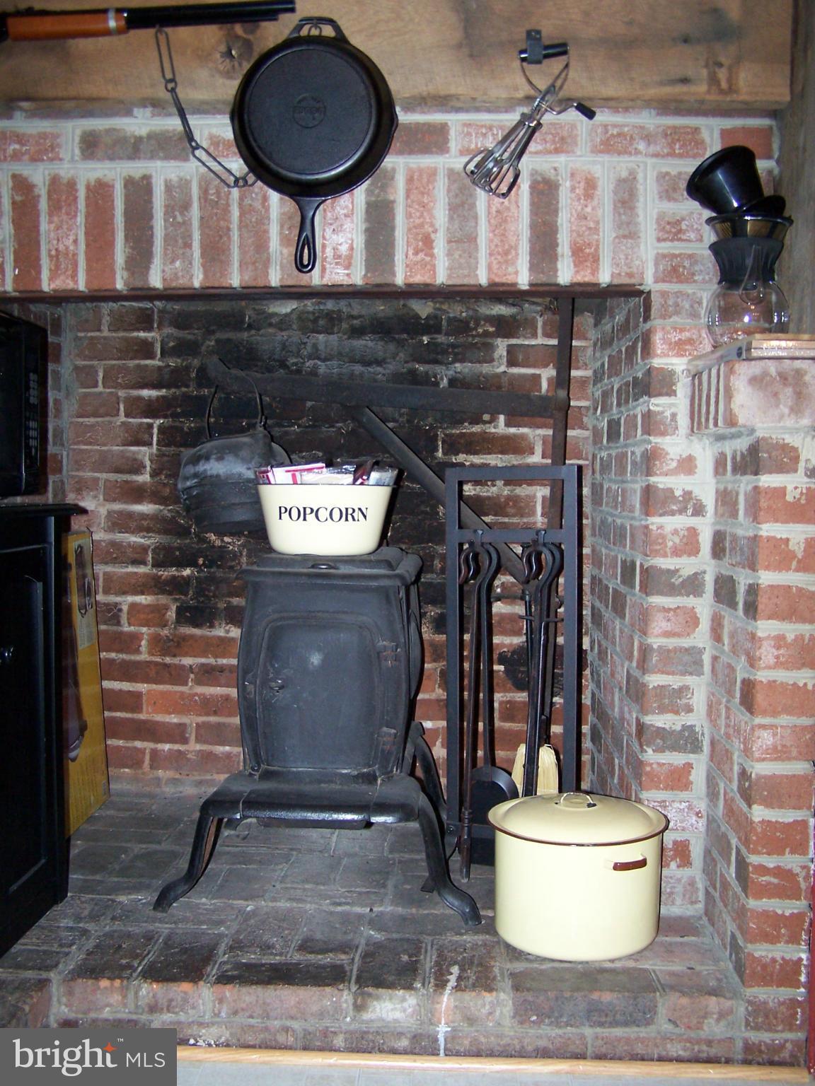 4256 Main Street Rohrersville, MD 21779 - Photo 3 of 26 a kitchen with a stove and a chair