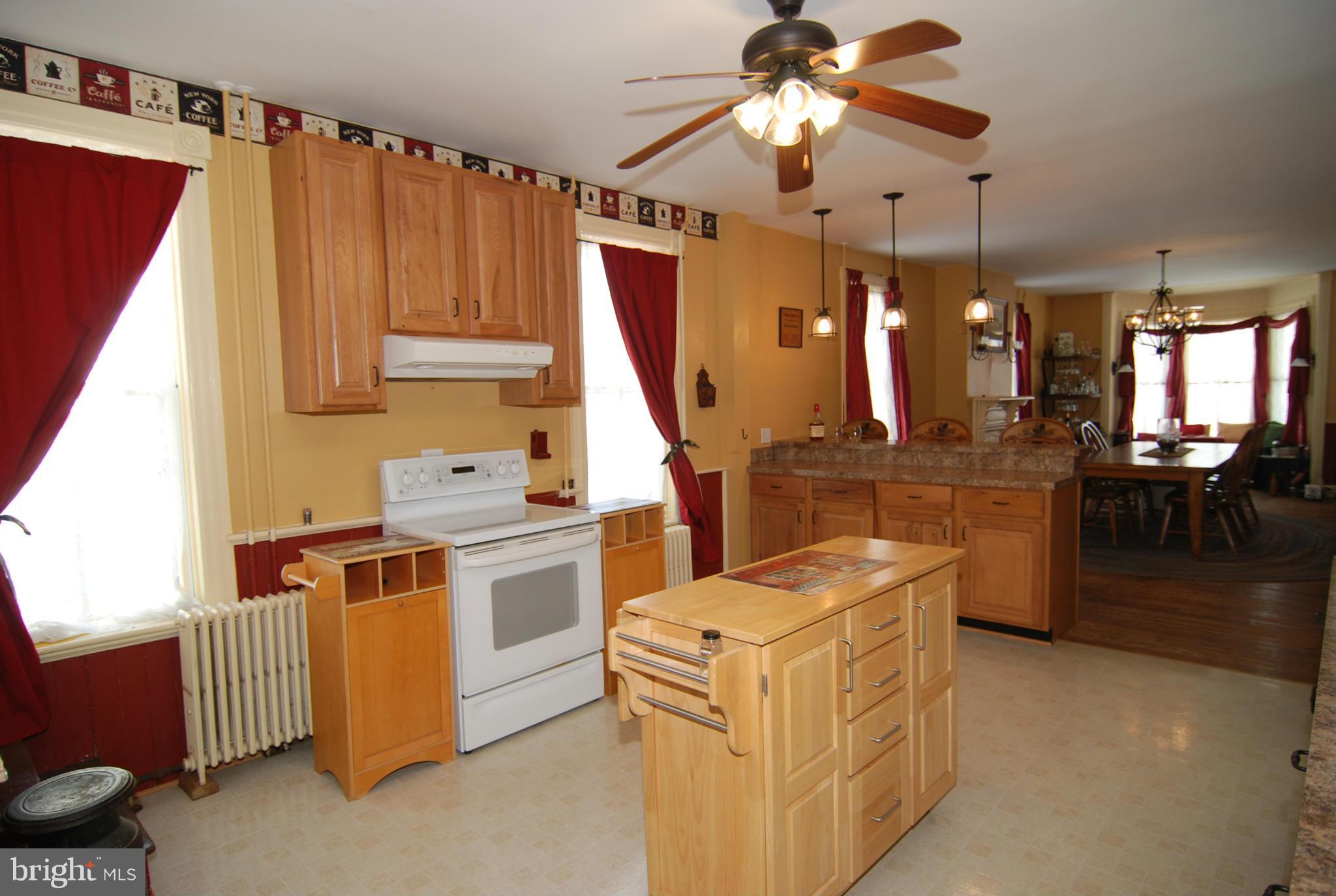 4256 Main Street Rohrersville, MD 21779 - Photo 4 of 26 a kitchen that has a lot of cabinets in it and a window