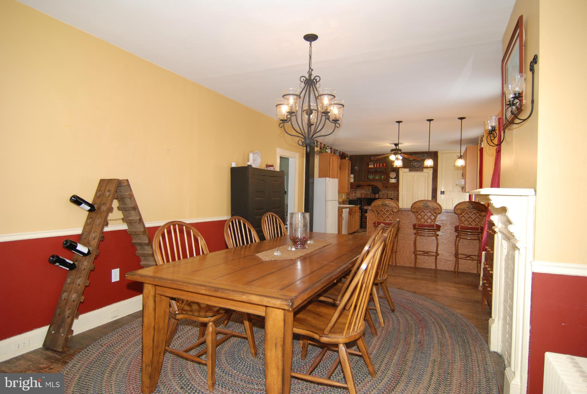 4256 Main Street Rohrersville, MD 21779 - Photo 5 of 26 a view of a dining room with furniture and wooden floor