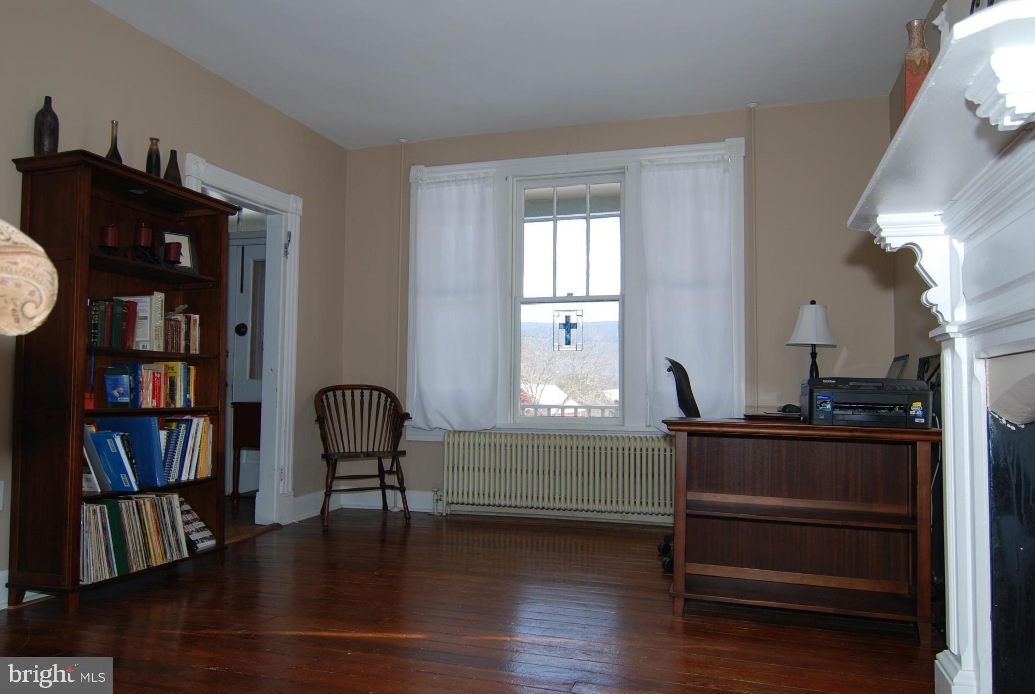 4256 Main Street Rohrersville, MD 21779 - Photo 9 of 26 a living room with furniture and a book shelf
