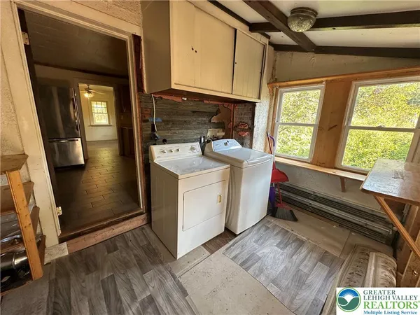 a utility room with dryer and washer