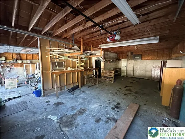 a view of an empty room with wooden walls