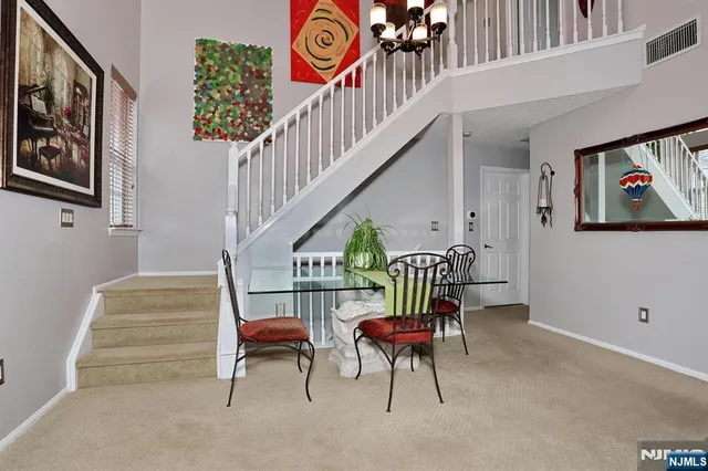 a dining room with furniture and entryway