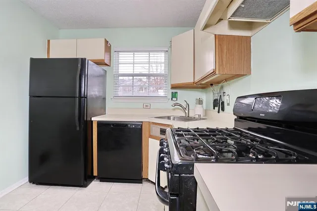 a kitchen with cabinets and appliances