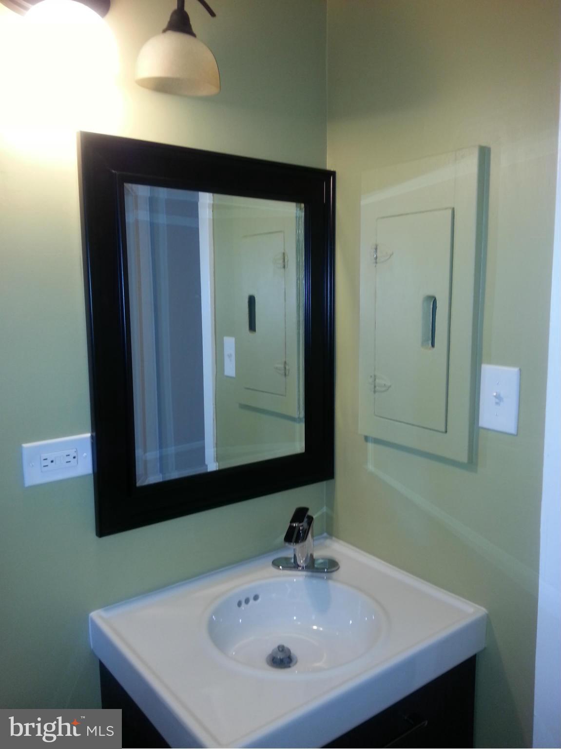 3800 Randolph Road Silver Spring, MD 20902 - Photo 12 of 23 a bathroom with a sink and a mirror