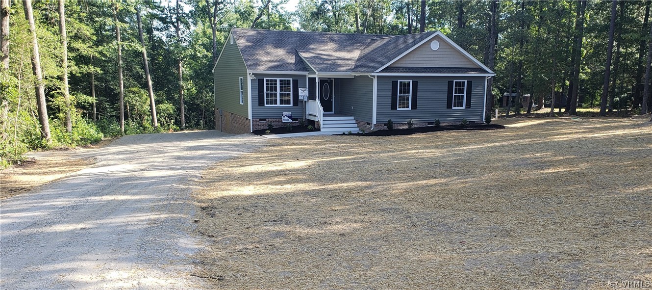 9202 Hunters Trail Road Petersburg, VA 23803 - Photo 17 of 17 a front view of a house with a garden