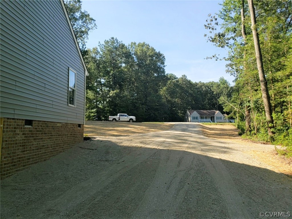 9202 Hunters Trail Road Petersburg, VA 23803 - Photo 2 of 17 a view of a house with a yard