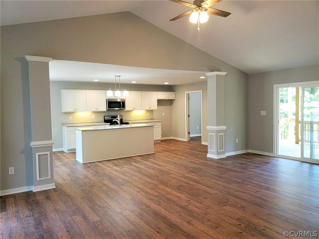 9202 Hunters Trail Road Petersburg, VA 23803 - Photo 3 of 17 a view of a kitchen with a sink a kitchen island with wooden floor and a kitchen space
