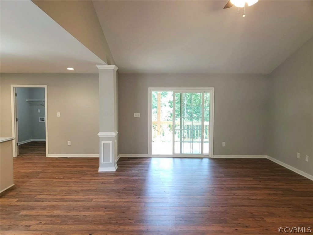 9202 Hunters Trail Road Petersburg, VA 23803 - Photo 4 of 17 a view of an empty room with wooden floor and a window