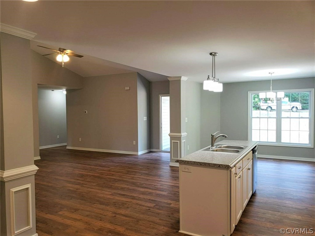 9202 Hunters Trail Road Petersburg, VA 23803 - Photo 7 of 17 a kitchen with granite countertop white cabinets and wooden floor