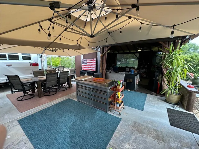 a view of a chairs and tables in patio