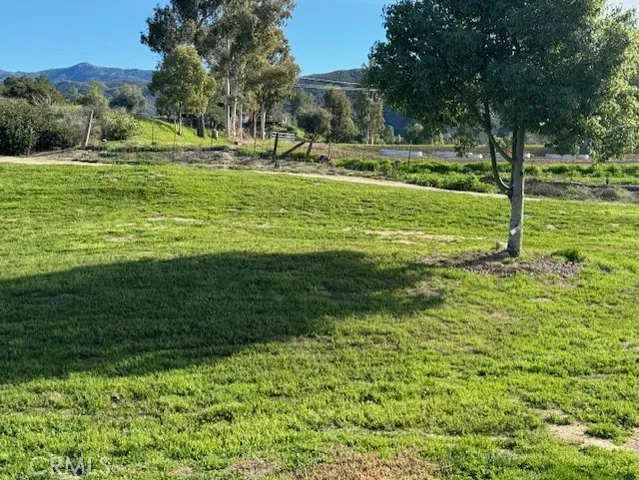 a swimming pool with outdoor seating and yard