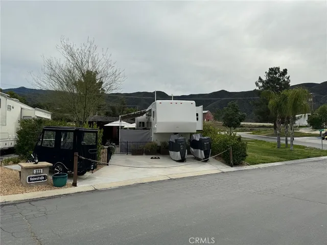 a view of a patio with table and chairs a barbeque