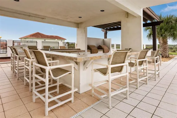 a swimming pool view with a outdoor seating space