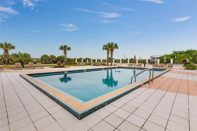 a view of a terrace with furniture and city view