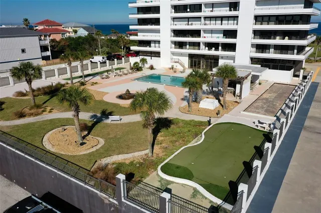 a view of a swimming pool with a patio