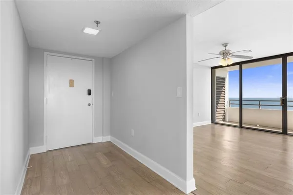 a view of an empty room with a window
