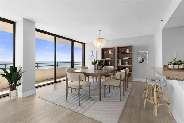 a view of a dining room with furniture window and outside view