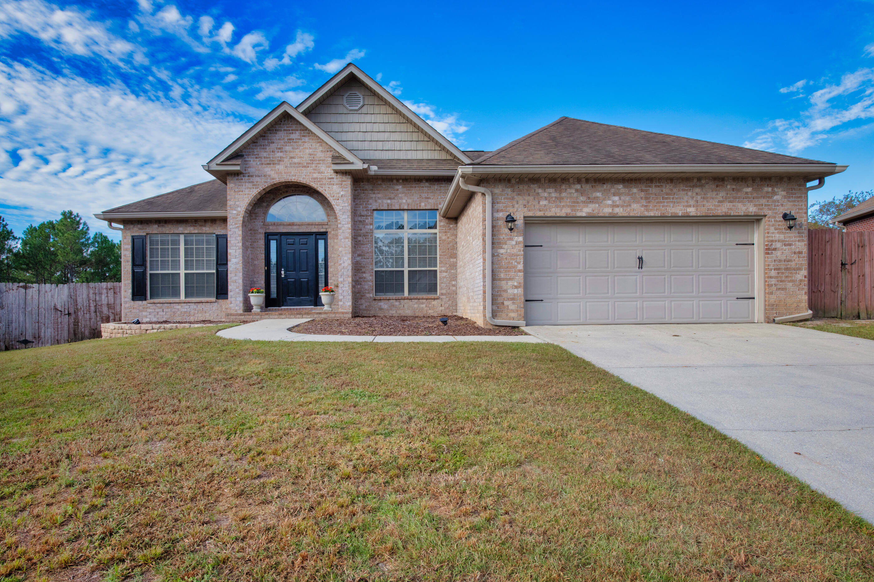 760 Lime Lane Crestview, FL 32536 - Photo 1 of 46 a front view of a house with yard and green space