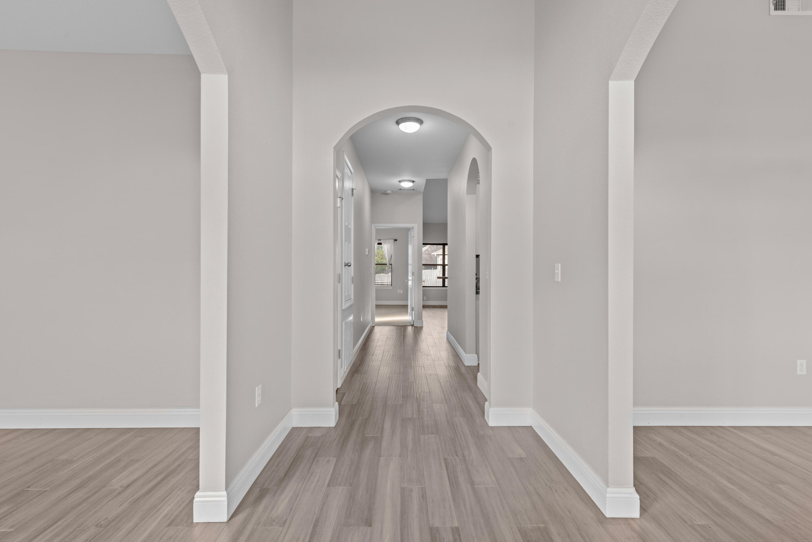 760 Lime Lane Crestview, FL 32536 - Photo 11 of 46 a view of a hallway with wooden floor