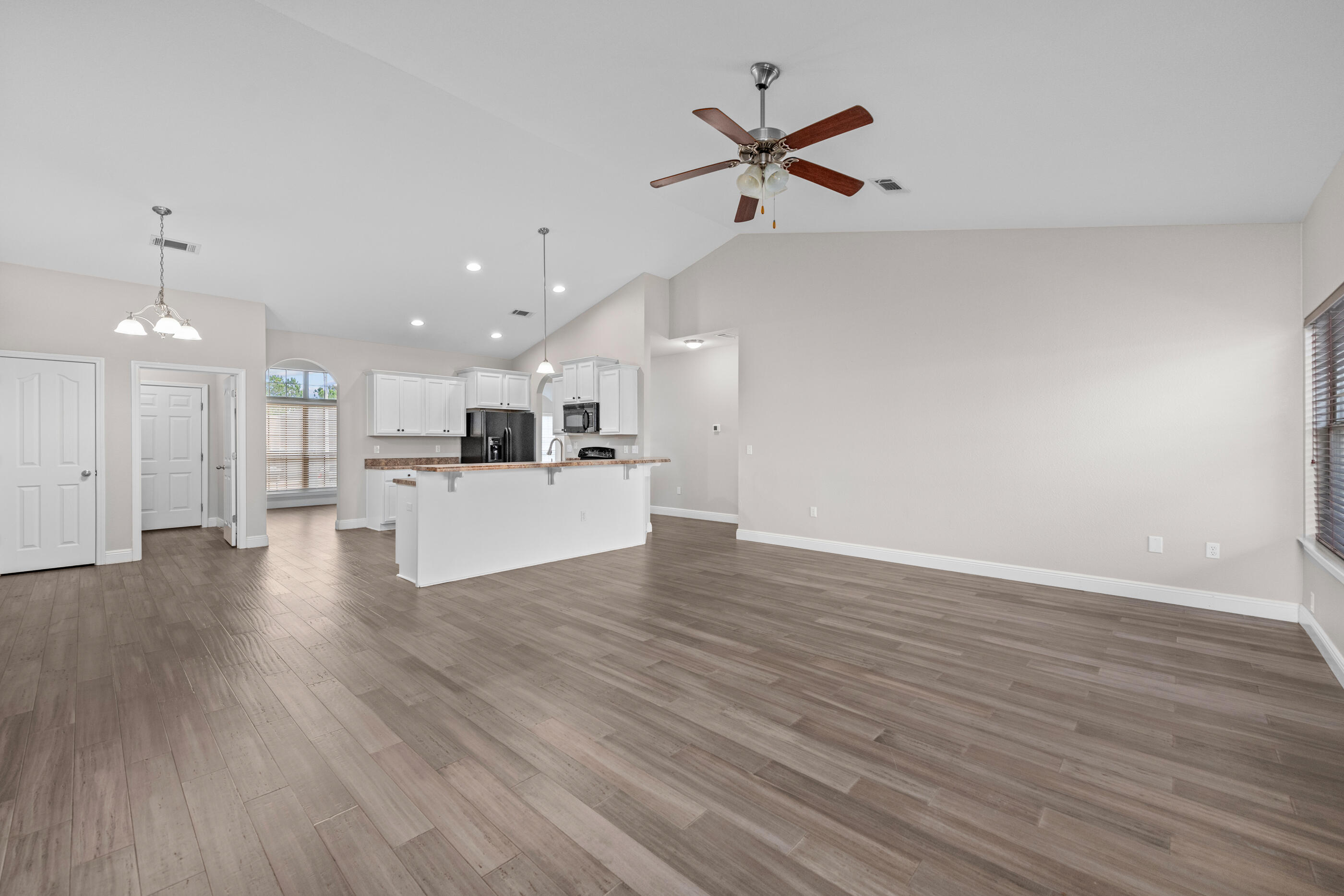 760 Lime Lane Crestview, FL 32536 - Photo 14 of 46 a view of a kitchen with a dishwasher cabinets and wooden floor