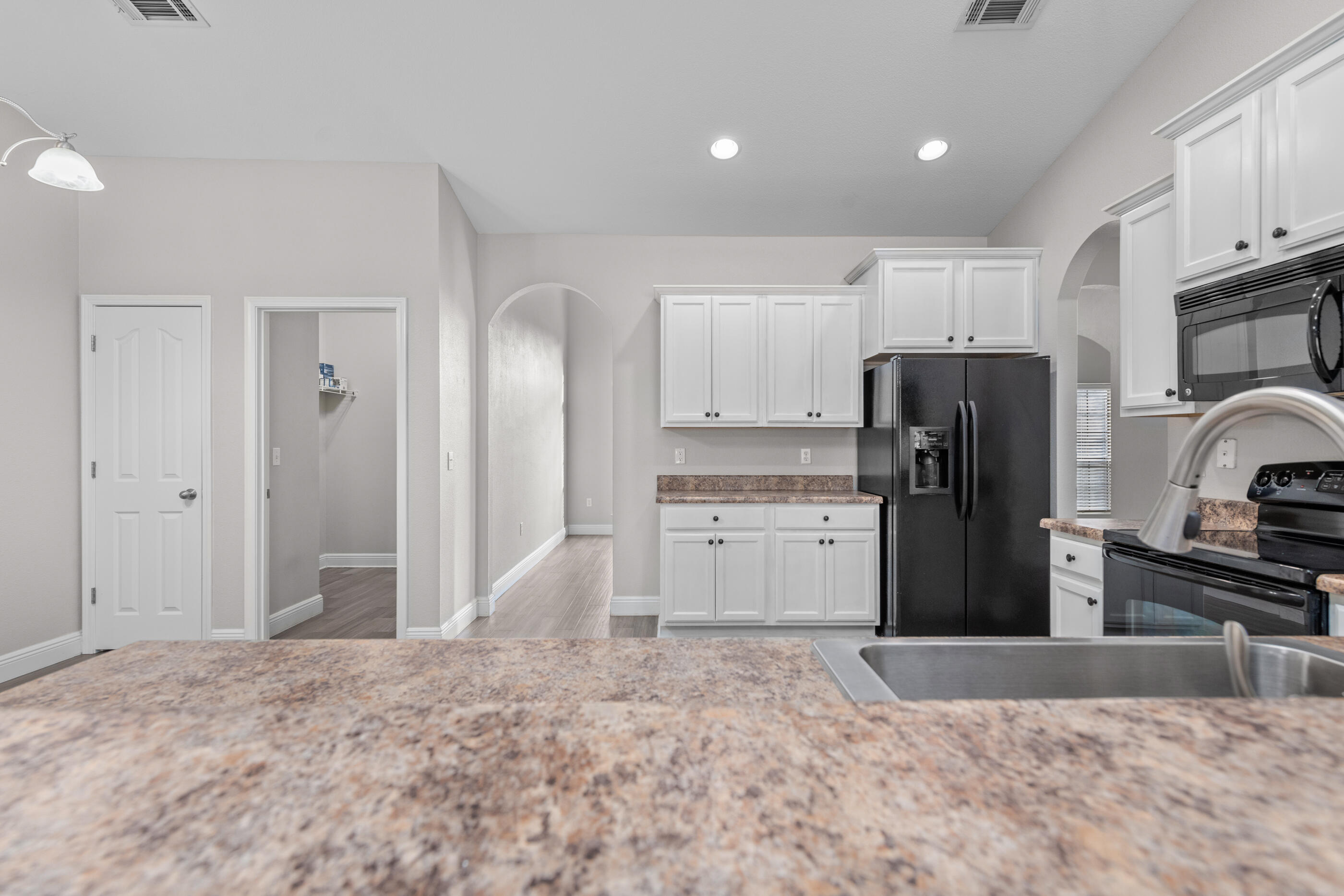 760 Lime Lane Crestview, FL 32536 - Photo 16 of 46 a kitchen with refrigerator and cabinets
