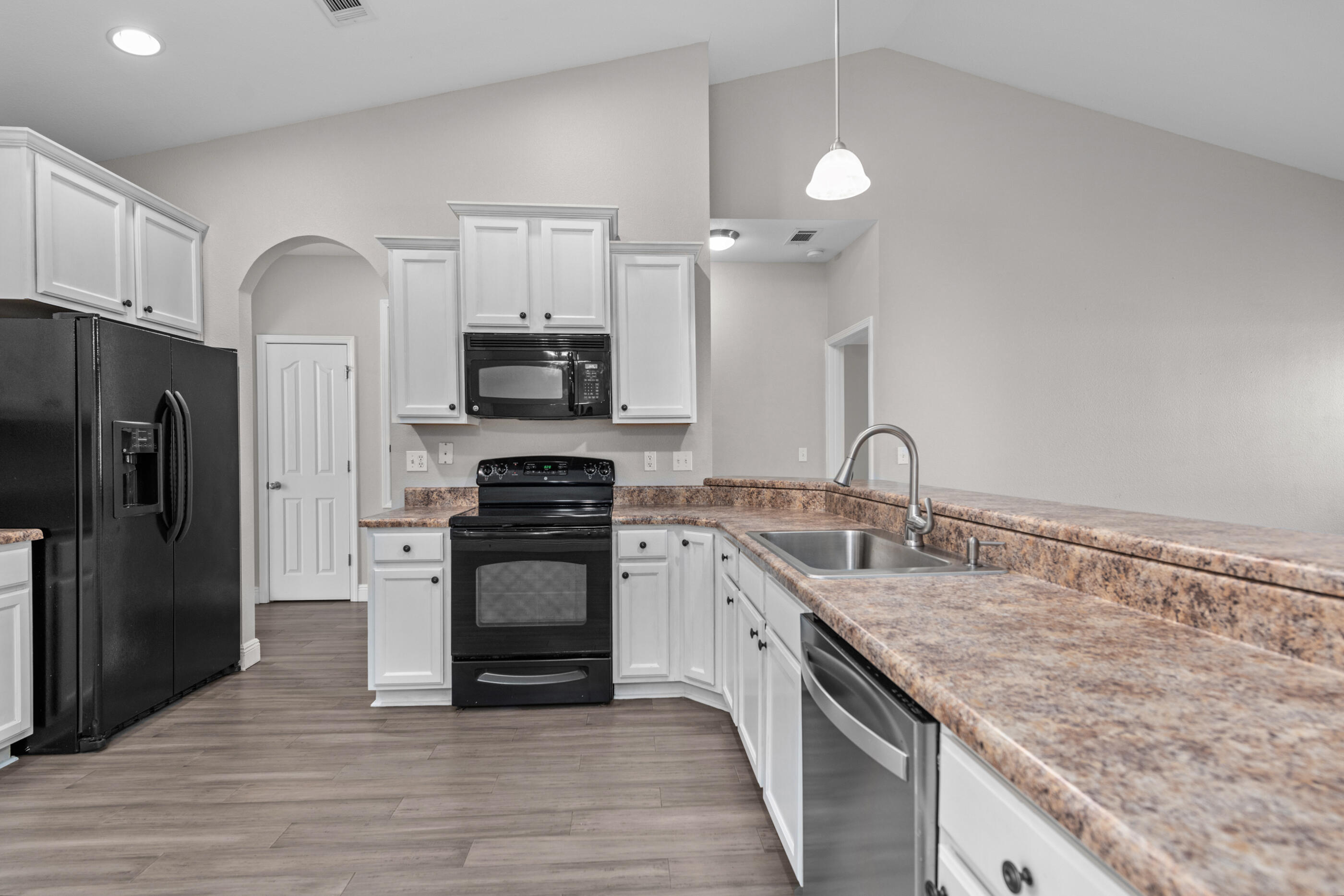 760 Lime Lane Crestview, FL 32536 - Photo 20 of 46 a kitchen with a sink stove and refrigerator