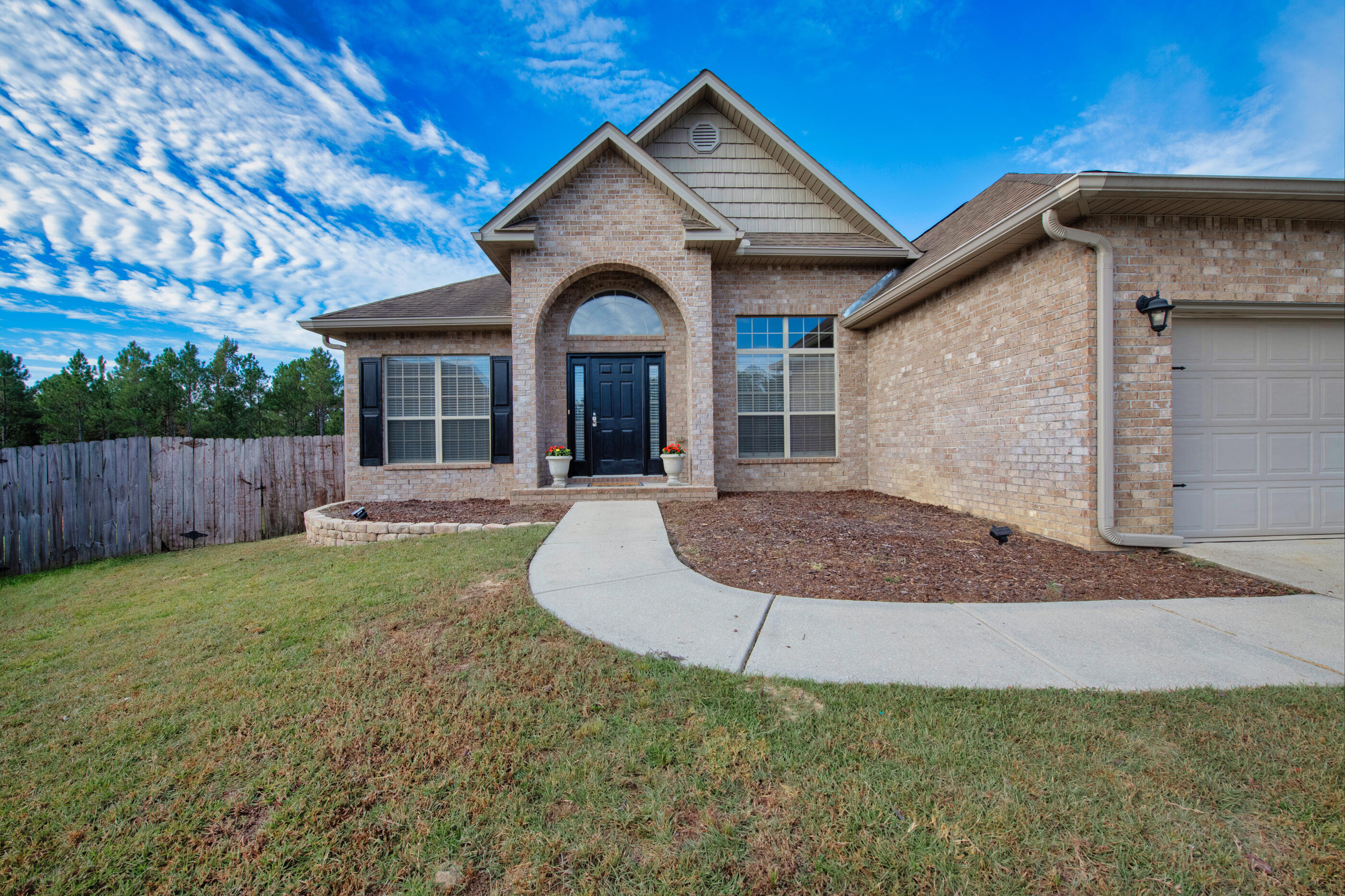 760 Lime Lane Crestview, FL 32536 - Photo 2 of 46 a front view of a house with yard