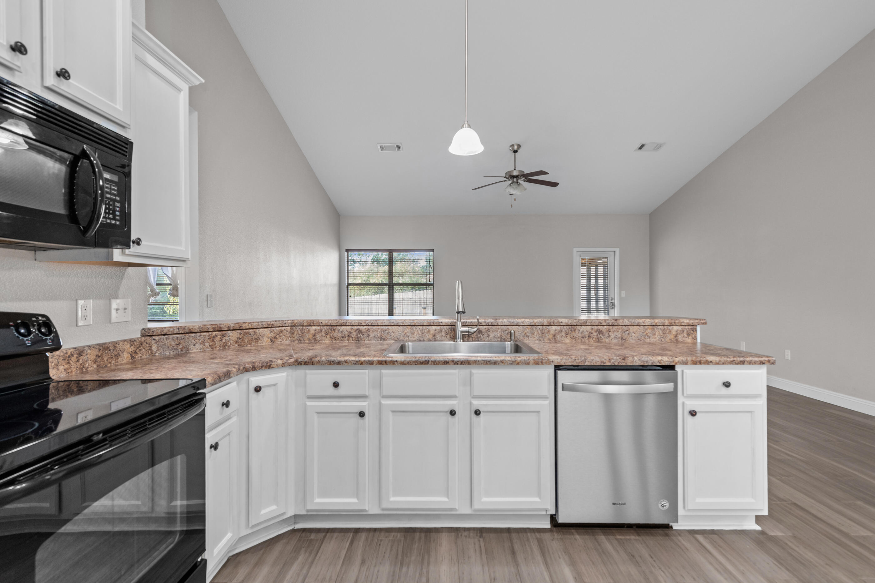760 Lime Lane Crestview, FL 32536 - Photo 22 of 46 a kitchen with granite countertop a sink and cabinets