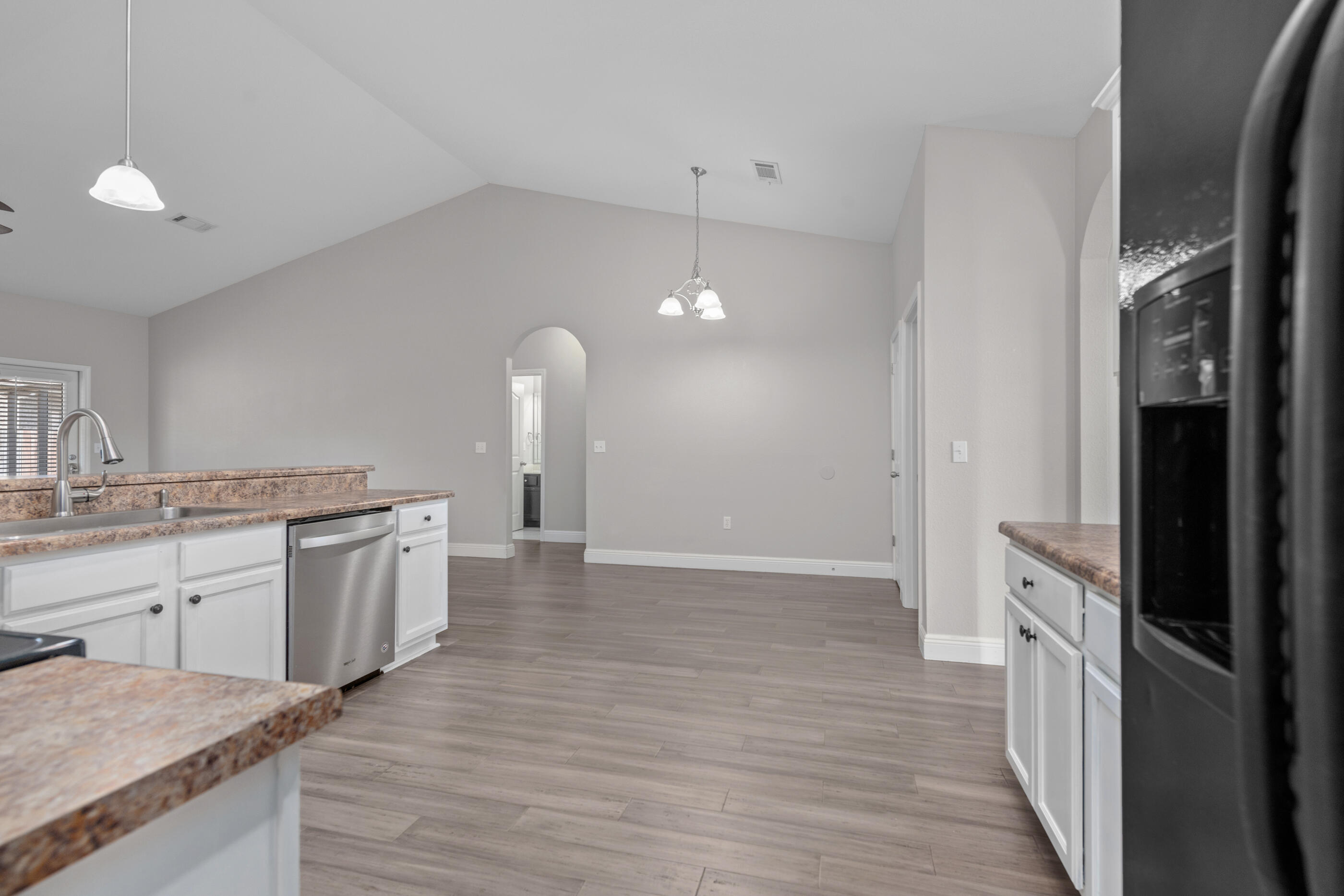 760 Lime Lane Crestview, FL 32536 - Photo 23 of 46 a kitchen with a sink and a refrigerator