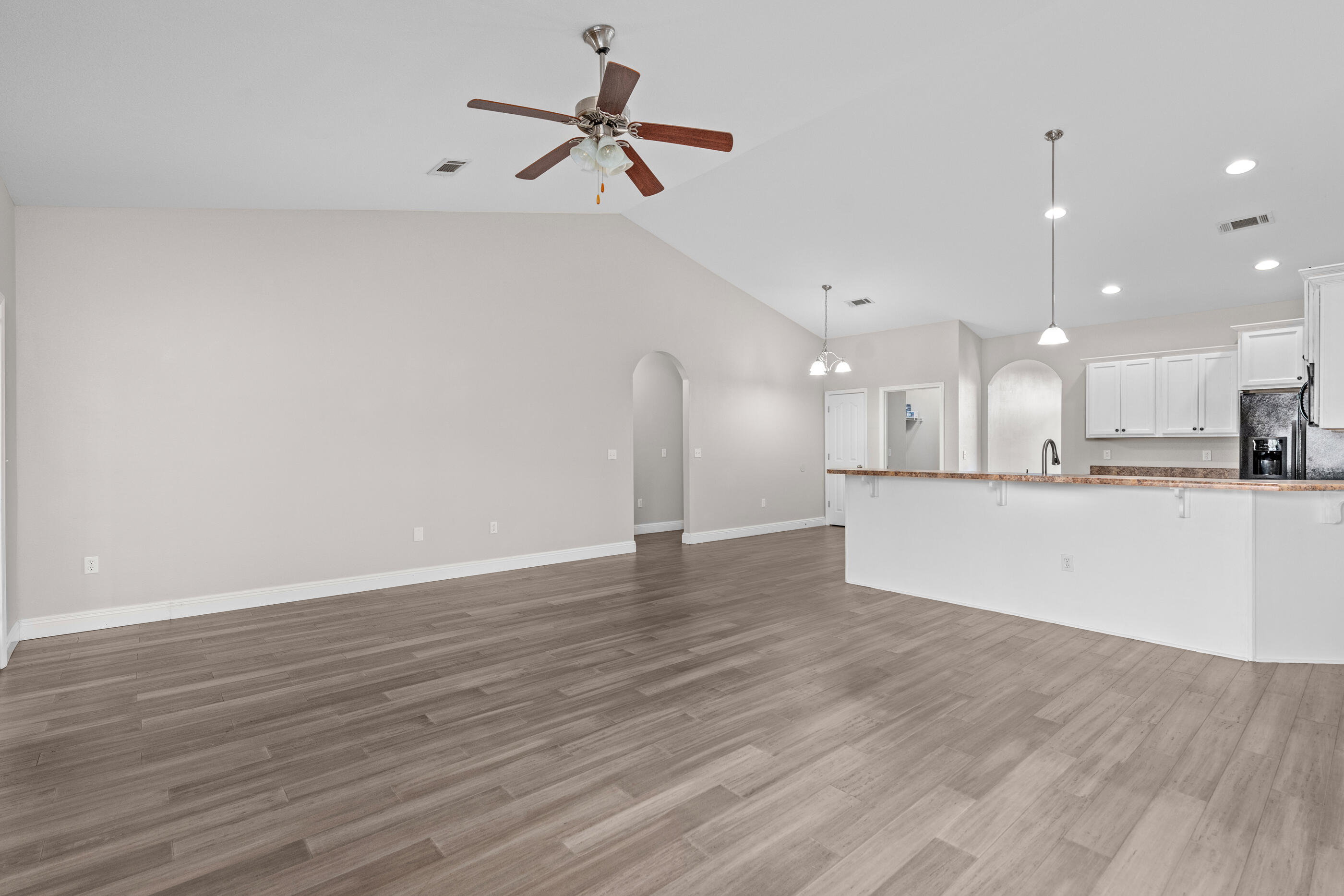 760 Lime Lane Crestview, FL 32536 - Photo 24 of 46 a view of a kitchen with a sink and a refrigerator