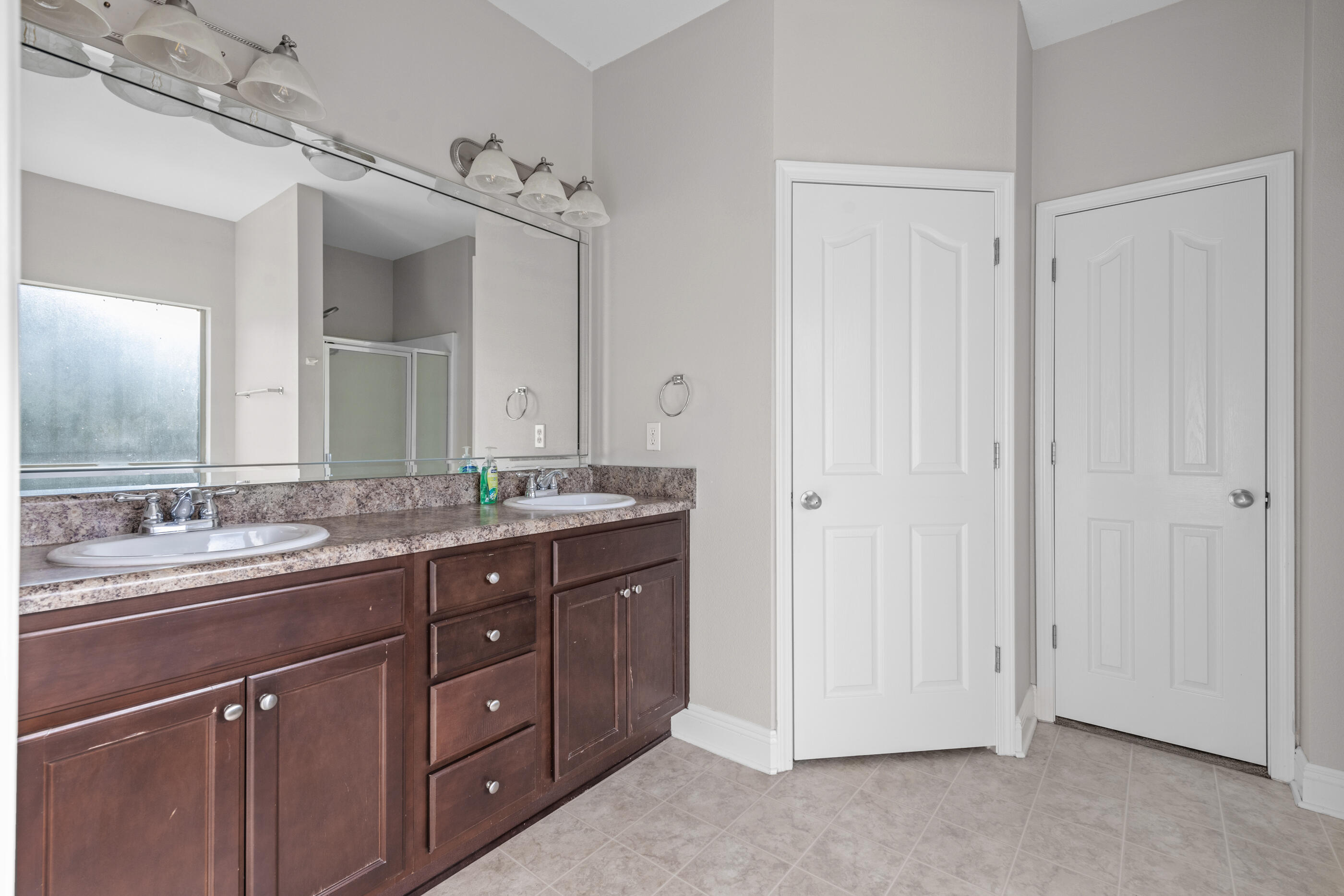 760 Lime Lane Crestview, FL 32536 - Photo 30 of 46 a bathroom with a granite countertop sink a mirror and a