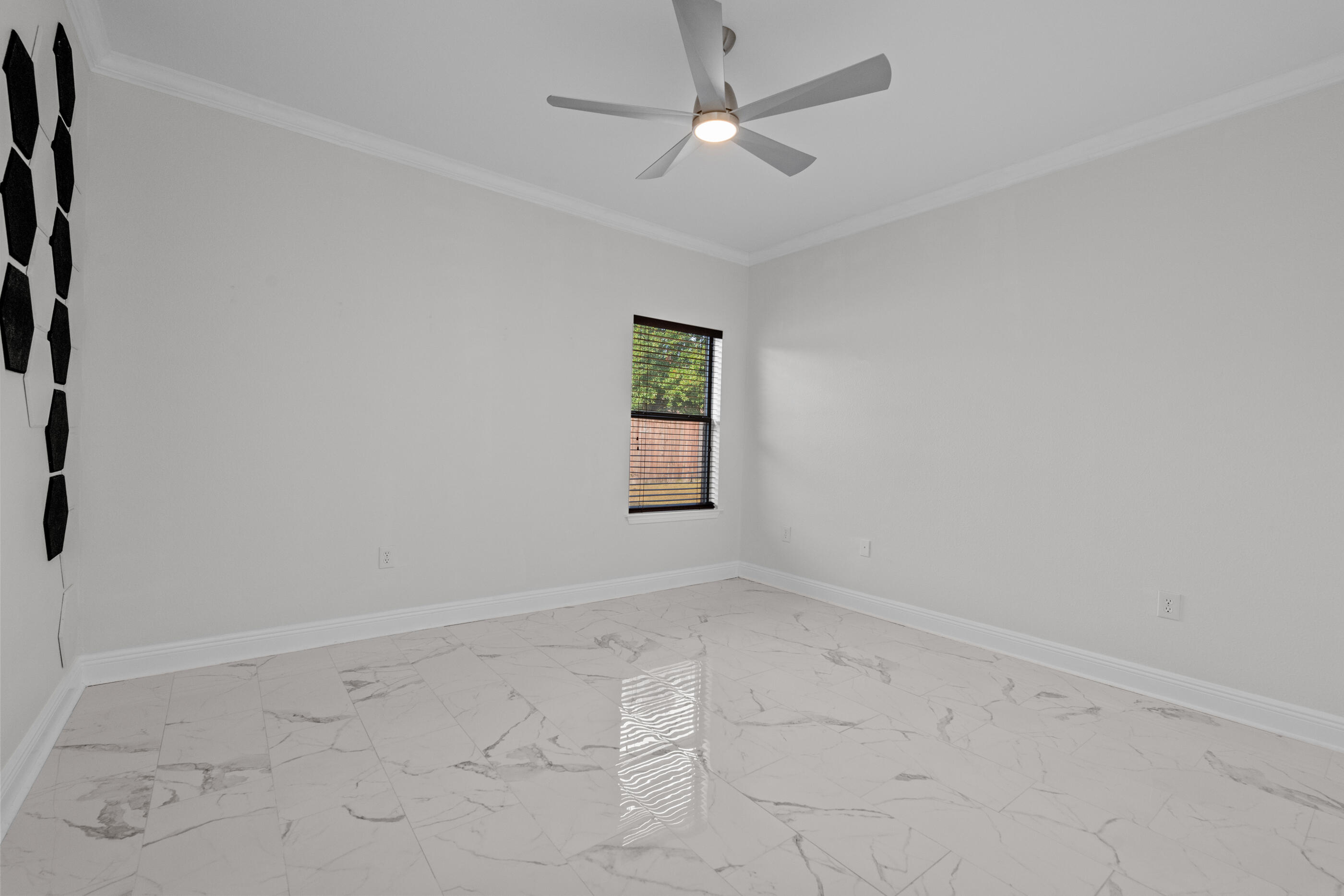 760 Lime Lane Crestview, FL 32536 - Photo 35 of 46 an empty room with a ceiling fan and a window