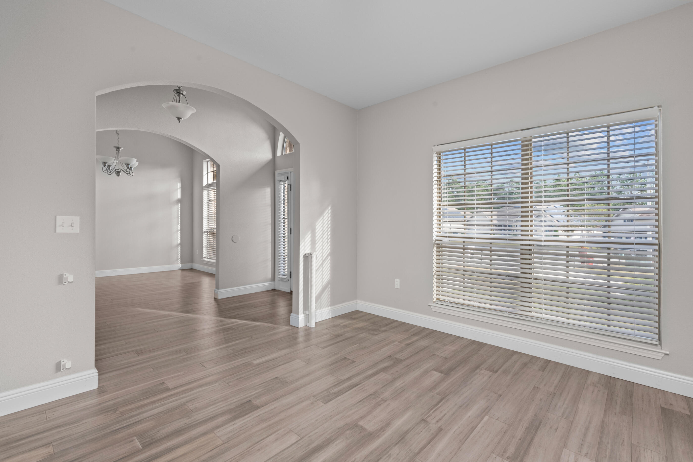 760 Lime Lane Crestview, FL 32536 - Photo 10 of 46 a view of a room with wooden floor and white walls