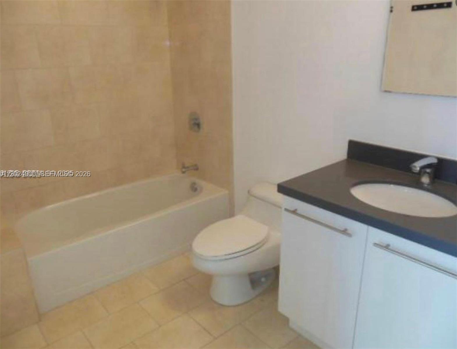90 Southwest 3rd Street, Unit 1811 Miami, FL 33130 - Photo 3 of 4 a bathroom with a sink toilet and shower