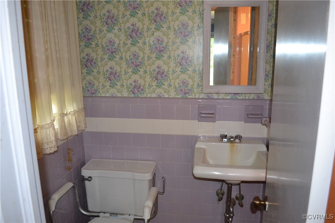 5109 West Hundred Road Chester, VA 23831 - Photo 12 of 34 a bathroom with a toilet and a sink