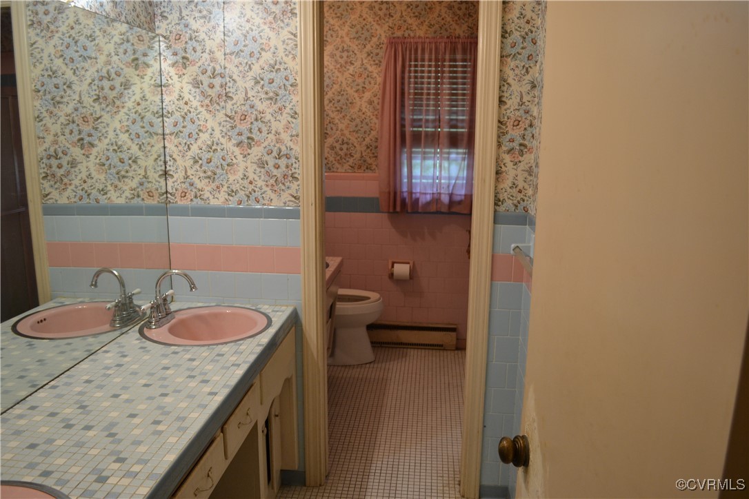 5109 West Hundred Road Chester, VA 23831 - Photo 14 of 34 a bathroom with a granite countertop sink and a toilet